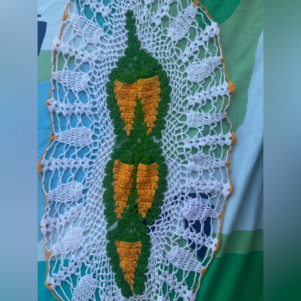 Crochet tablecloth with yellow carrots